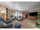 Spacious living room with large bay window, plush seating, and stylish decor at 5270 Tabor St, Arvada, CO 80002