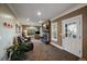 Cozy living room boasts stone fireplace, natural lighting, and comfortable seating near a window at 5270 Tabor St, Arvada, CO 80002