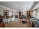 Bright and airy living room featuring built-in bookshelves and a comfortable seating area at 5270 Tabor St, Arvada, CO 80002