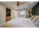Bright bedroom featuring a large window, neutral tones, and an open view to the neighborhood at 5270 Tabor St, Arvada, CO 80002