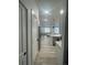 Hallway view into living room and kitchen area at 9642 E Idaho Pl, Aurora, CO 80247