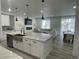 Bright, open kitchen with stainless steel appliances and an oversized island at 9642 E Idaho Pl, Aurora, CO 80247