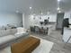 Spacious living room with open concept kitchen and adjacent dining area at 9642 E Idaho Pl, Aurora, CO 80247