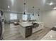 Open concept kitchen and living area with modern finishes and ample natural light at 9642 E Idaho Pl, Aurora, CO 80247