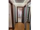 Bathroom hallway with blue doors and wood floors at 3335 Dexter St, Denver, CO 80207
