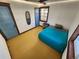 Charming bedroom with hardwood floors and teal bedding at 3335 Dexter St, Denver, CO 80207