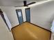 Spacious bedroom with wood floors, and two doors at 3335 Dexter St, Denver, CO 80207