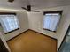 Well-lit bedroom featuring wood floors and a ceiling fan at 3335 Dexter St, Denver, CO 80207