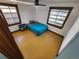 Cozy bedroom with hardwood floors and teal bedding at 3335 Dexter St, Denver, CO 80207