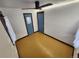 Spacious bedroom with wood floors, and two doors at 3335 Dexter St, Denver, CO 80207