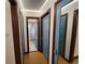 Bright hallway with updated doors and access to bathroom at 3335 Dexter St, Denver, CO 80207