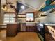 Bright kitchen with stainless steel appliances and unique wood cabinets at 3335 Dexter St, Denver, CO 80207
