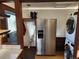 Laundry room with full-size washer, dryer, and refrigerator at 3335 Dexter St, Denver, CO 80207