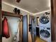Laundry room with washer, dryer, and extra storage at 3335 Dexter St, Denver, CO 80207