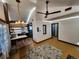 Open living area with ceiling fan and hardwood floors at 3335 Dexter St, Denver, CO 80207