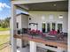 Expansive balcony featuring stylish outdoor furniture, a grill, and scenic views, perfect for outdoor relaxation and entertainment at 3630 Mesa Verde Rd, Monument, CO 80132