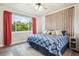 Comfortable bedroom featuring a ceiling fan, updated window and custom headboard at 3630 Mesa Verde Rd, Monument, CO 80132