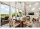 Light filled dining area with deck access, stone fireplace and rustic style at 3630 Mesa Verde Rd, Monument, CO 80132