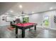 Spacious game room complete with a billiards table, workspace, and ample lighting at 3630 Mesa Verde Rd, Monument, CO 80132