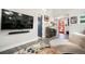 Inviting living room featuring a large TV, soundbar and unique interior design at 3630 Mesa Verde Rd, Monument, CO 80132