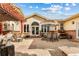 Spacious backyard patio with pergola, brick accents, seating, dining and outdoor entertaining area at 2400 S Clayton St, Denver, CO 80210