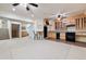 Finished basement area with a kitchenette, bar seating, and ample open space at 2400 S Clayton St, Denver, CO 80210