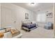 Cozy bedroom with a twin bed, a white metal frame, and charming decor at 2400 S Clayton St, Denver, CO 80210