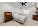 Bright bedroom with ceiling fan, neutral walls, and classic furnishings at 2400 S Clayton St, Denver, CO 80210