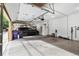 Spacious garage interior with epoxy flooring and ample storage at 2400 S Clayton St, Denver, CO 80210