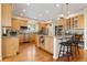 Spacious kitchen with stainless steel appliances, granite countertops, a central island, and ample cabinet space at 2400 S Clayton St, Denver, CO 80210
