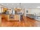Open kitchen featuring granite countertops, stainless appliances, and a central island with barstool seating at 2400 S Clayton St, Denver, CO 80210