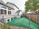 View of the backyard with a dog run, offering a safe and enclosed space for pets to play outdoors at 4892 S Robb St, Littleton, CO 80127