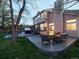 A beautifully designed backyard patio featuring a hot tub, outdoor seating, and a fire pit at 4892 S Robb St, Littleton, CO 80127