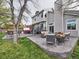 Inviting outdoor space with patio, hot tub, dining set, and comfortable seating, perfect for entertaining at 4892 S Robb St, Littleton, CO 80127