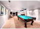 Basement rec room featuring a pool table and lounge area at 4892 S Robb St, Littleton, CO 80127