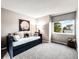 Cozy bedroom features a large window with a view, a daybed, and plush carpeting at 4892 S Robb St, Littleton, CO 80127