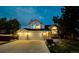 Charming two-story home with a three car garage and well-manicured lawn at 4892 S Robb St, Littleton, CO 80127