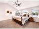 Inviting main bedroom with vaulted ceilings, comfortable bedding, windows with blinds, and natural light at 4892 S Robb St, Littleton, CO 80127