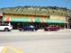 Morrison Inn restaurant featuring colorful awnings and exterior, offering a fun dining experience at 4892 S Robb St, Littleton, CO 80127