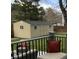 Backyard storage shed is visible from the deck, framed by green grass at 4892 S Robb St, Littleton, CO 80127
