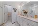 Bright bathroom featuring a double vanity, stone countertops, and a separate water closet at 430 Millwall Cir, Castle Pines, CO 80108