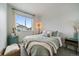 Inviting bedroom with soft lighting and a decorative throw blanket at 430 Millwall Cir, Castle Pines, CO 80108