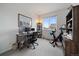 Bedroom with an exercise bike, desk, shelving, and natural light at 430 Millwall Cir, Castle Pines, CO 80108