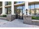 Building entrance features large windows, columns and black entry door for a welcoming feel at 1210 E Colfax Ave # 302, Denver, CO 80218