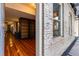 Hallway with hardwood floors and a custom built-in bookshelf at 1210 E Colfax Ave # 302, Denver, CO 80218