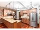 Well-equipped kitchen with granite counters, stainless steel appliances, and brick accents at 1210 E Colfax Ave # 302, Denver, CO 80218