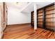 Spacious living room featuring hardwood floors and custom built-in shelving at 1210 E Colfax Ave # 302, Denver, CO 80218