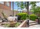Charming backyard patio with firepit and landscaping at 1210 E Colfax Ave # 302, Denver, CO 80218
