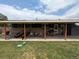 Cozy back porch with lawn equipment and furniture, perfect for outdoor relaxing and entertaining at 290 W 1St Ave, Broomfield, CO 80020