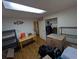 Unfinished basement area with wood-look floors and shelves at 290 W 1St Ave, Broomfield, CO 80020